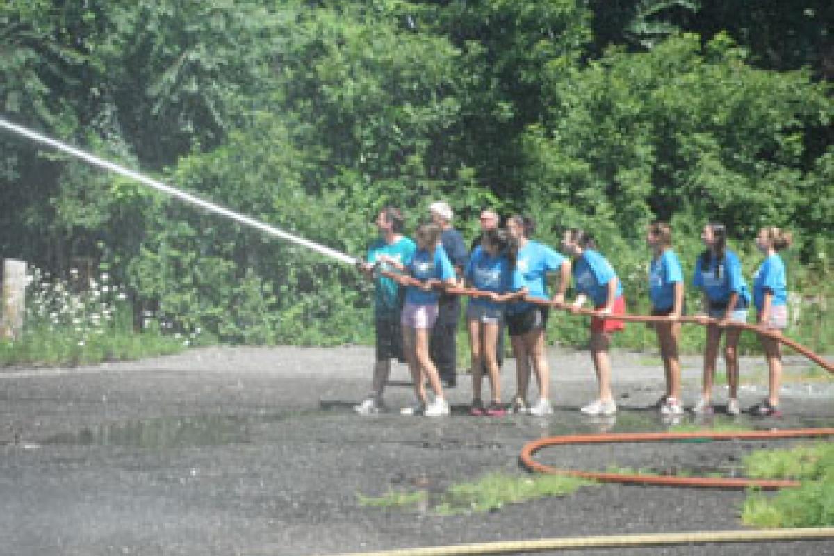Campers learn how to operate hoselines
